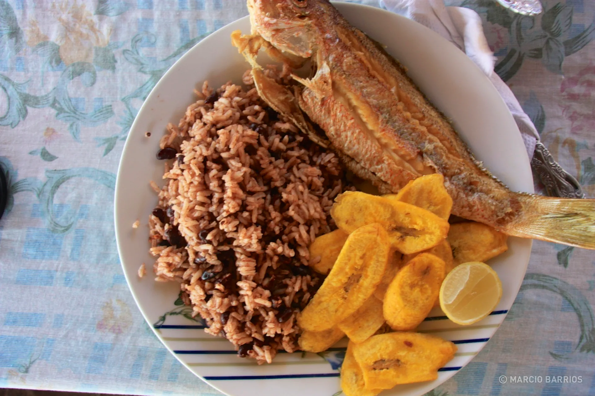 Fried fish with red beans and rice, and tajadas Fried fish with red beans and rice, and tajadas