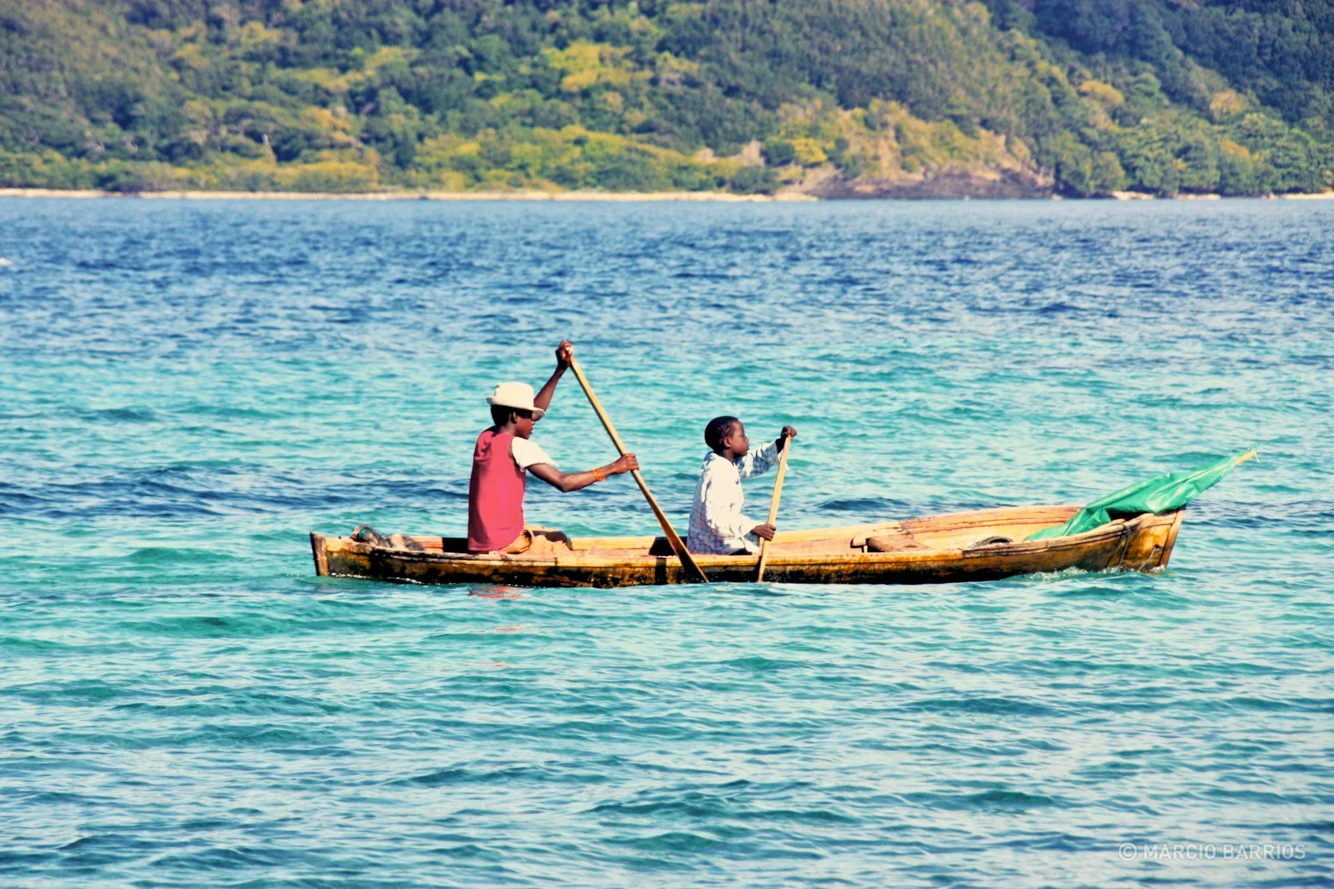 A couple of garifuna boys with a canoe A couple of garifuna boys with a canoe