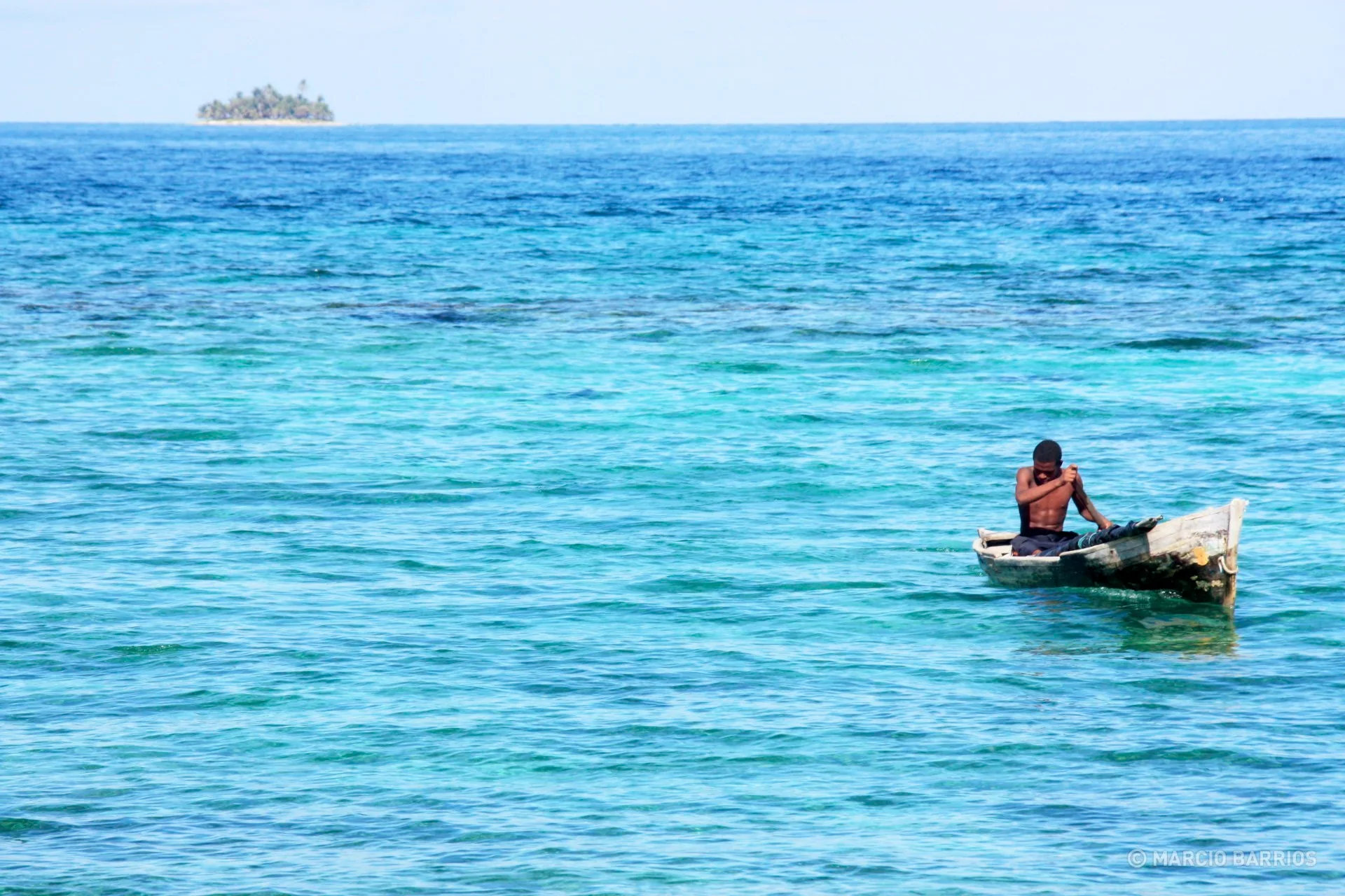 Garifuna boy with his canoe Garifuna boy with his canoe